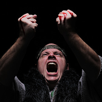 Killer with bloody dagger